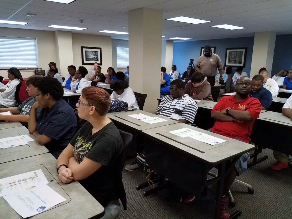 A group of students in a classroom setting during a career service workshop